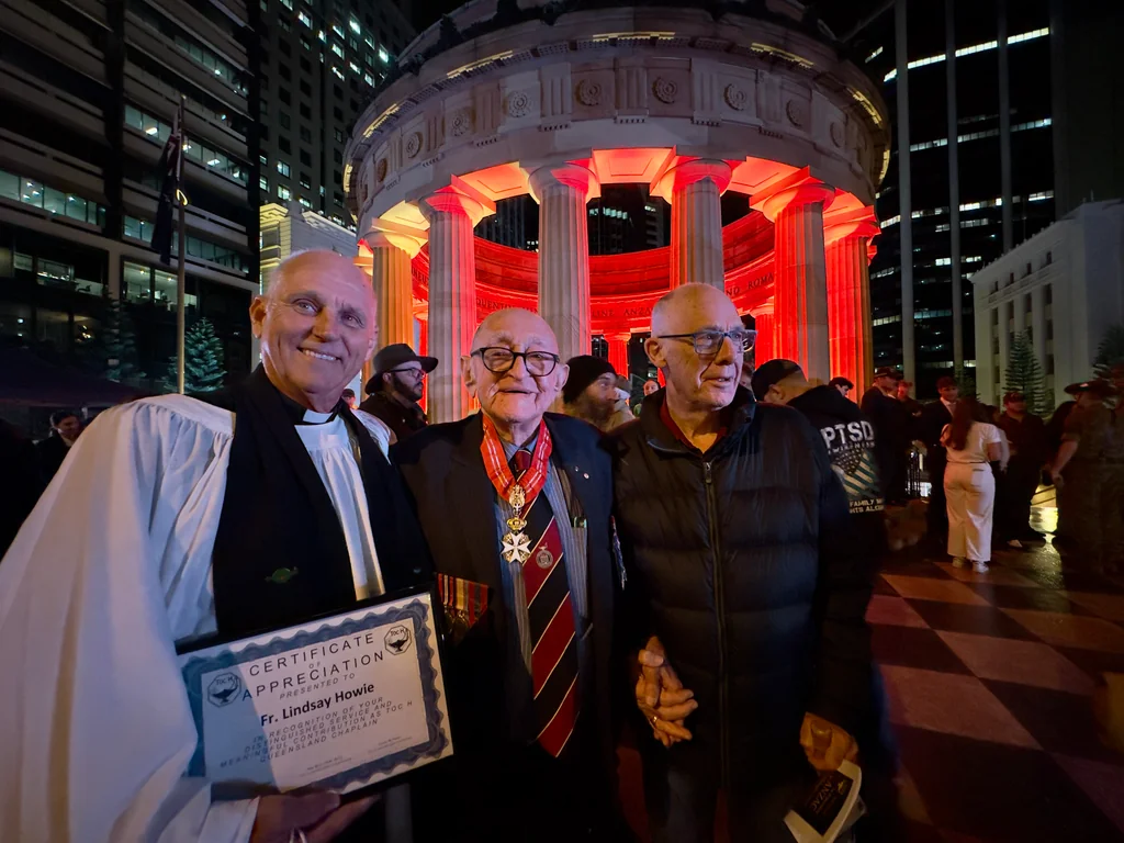Fr. Lindsay Howie receives a Certificate of Appreciation alongside Raymond F. Geise OAM KCSJ MACE and Bishop Bill Ray